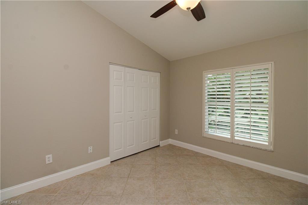 3935 70th Avenue Northeast Naples, FL 34120 - Photo 45 of 50 an empty room with ceiling fan and window