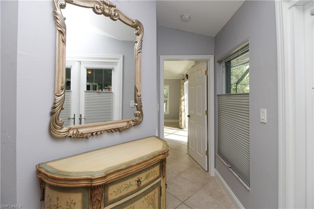 3935 70th Avenue Northeast Naples, FL 34120 - Photo 47 of 50 a bathroom with a mirror and a sink