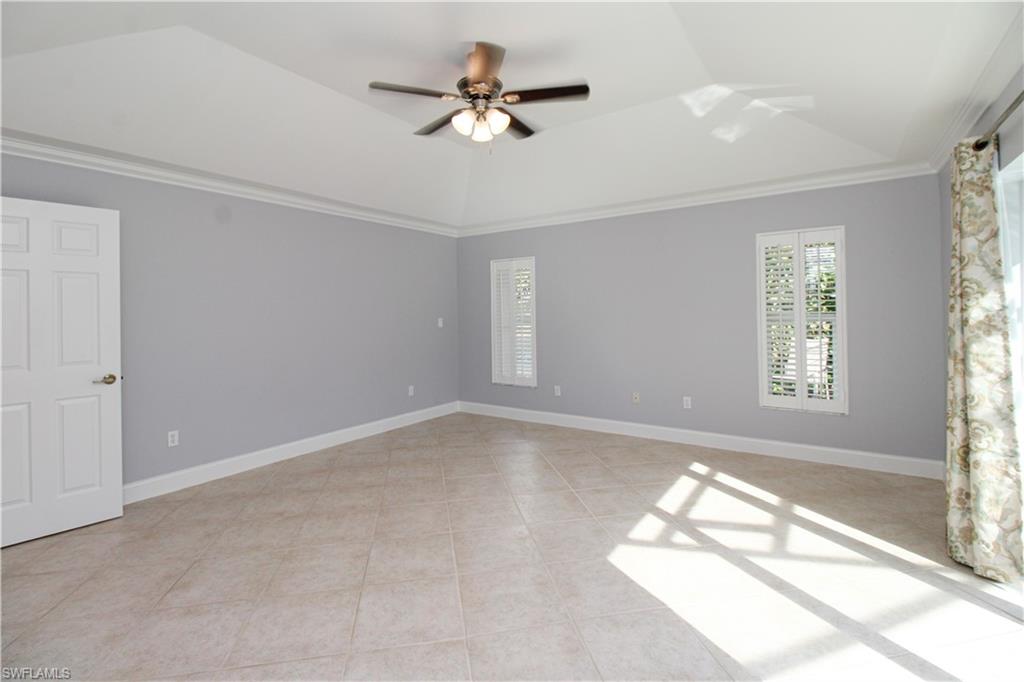 3935 70th Avenue Northeast Naples, FL 34120 - Photo 48 of 50 wooden floor in an empty room with a window