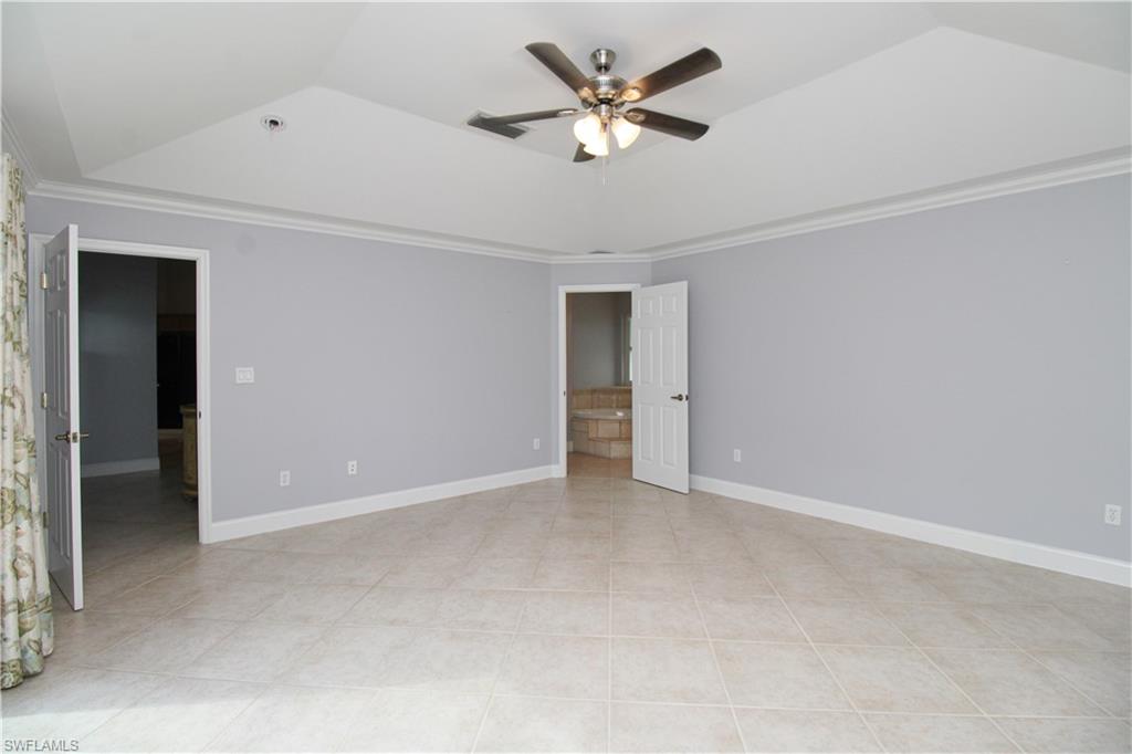 3935 70th Avenue Northeast Naples, FL 34120 - Photo 50 of 50 an empty room with a ceiling fan and a window