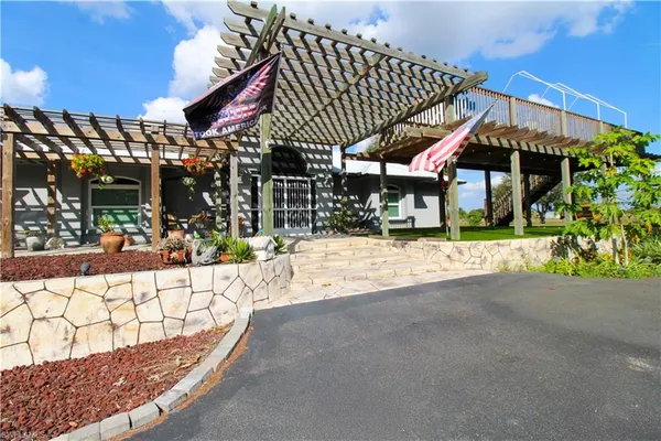 a view of a chairs and table in patio