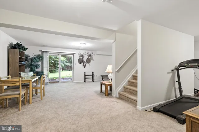 a view of a livingroom with furniture and windows