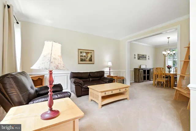a living room with furniture and a table