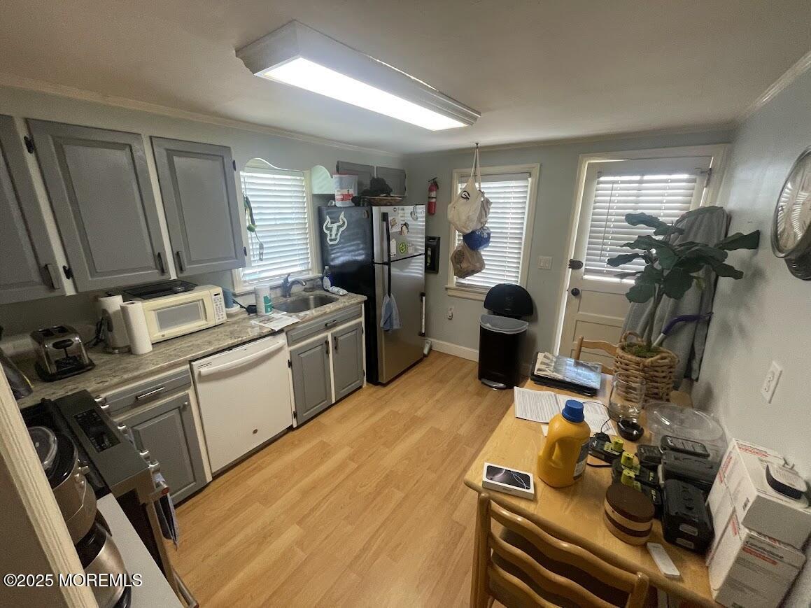 137 Inskip Avenue Ocean Grove, NJ 07756 - Photo 2 of 11 a room with furniture a flat screen tv and a sink
