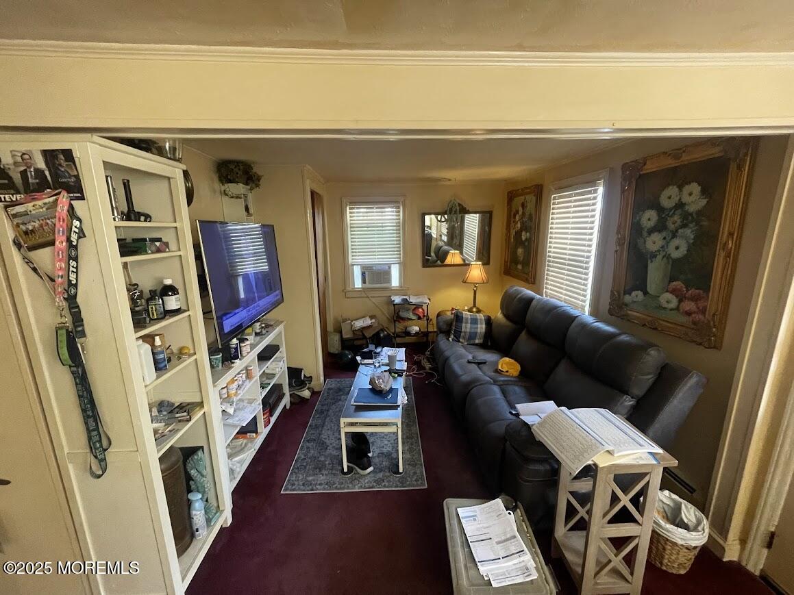 137 Inskip Avenue Ocean Grove, NJ 07756 - Photo 6 of 11 a living room with furniture and a flat screen tv