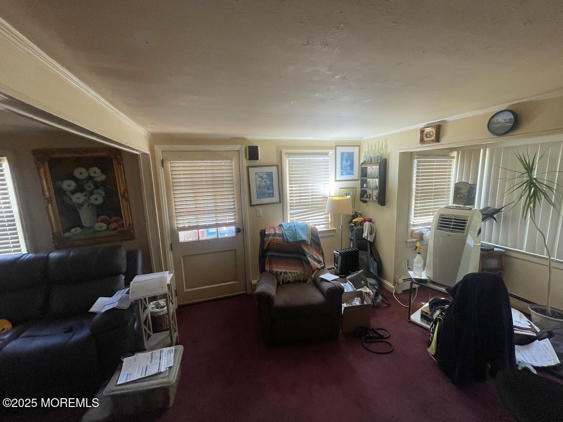 137 Inskip Avenue Ocean Grove, NJ 07756 - Photo 9 of 11 a living room with furniture windows and a flat screen tv