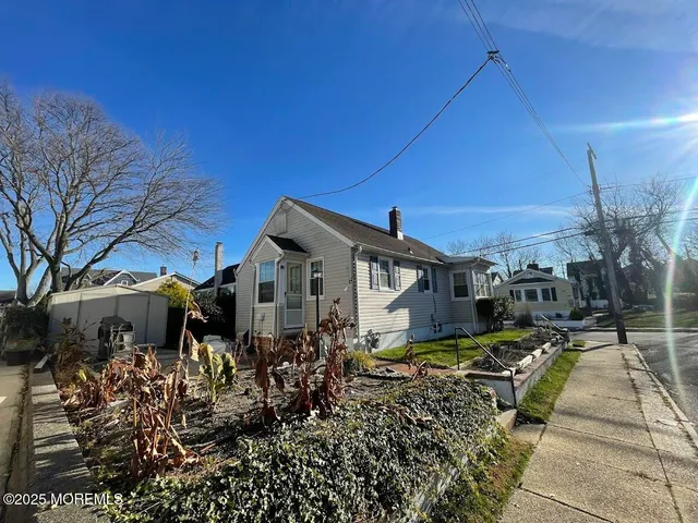 a view of a house with wooden fence