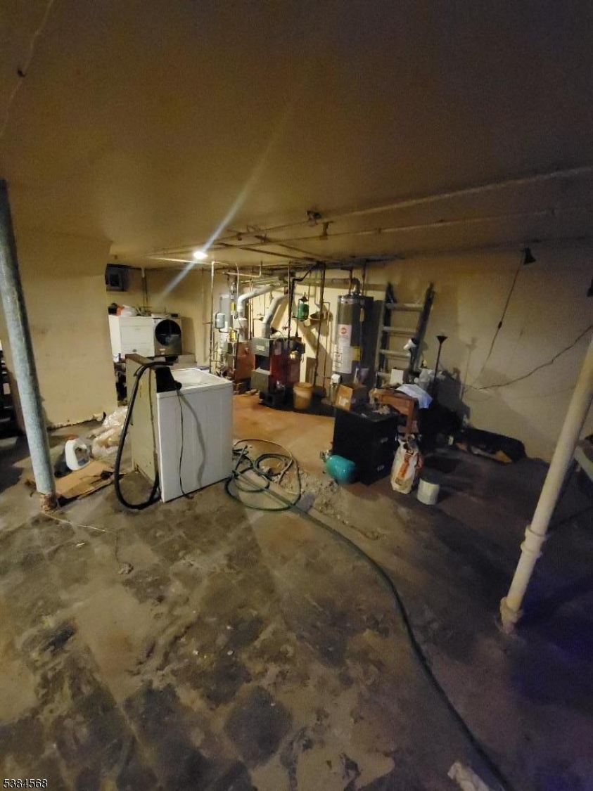 20 Greene Terrace Irvington, NJ 07111 - Photo 12 of 21 a view of a garage with a white car parked