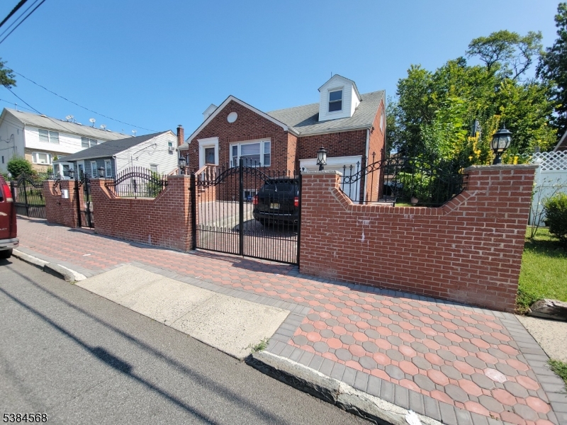20 Greene Terrace Irvington, NJ 07111 - Photo 13 of 21 a front view of a house with a yard