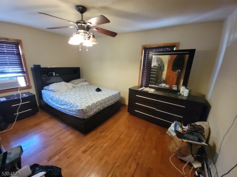 20 Greene Terrace Irvington, NJ 07111 - Photo 20 of 21 a bedroom with a bed and wooden floor