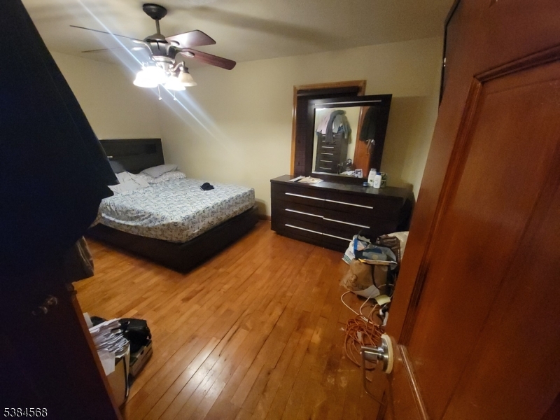20 Greene Terrace Irvington, NJ 07111 - Photo 4 of 21 a bedroom with a bed and ceiling fan