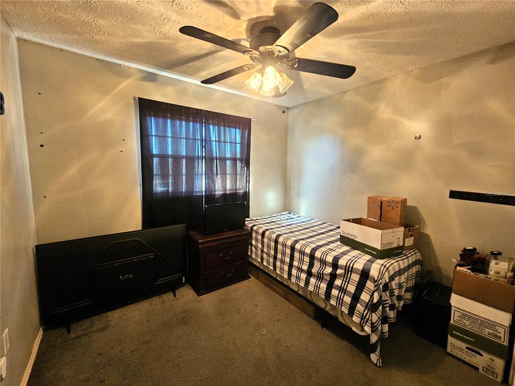 13308 Duck Lake Canal Road Dade City, FL 33525 - Photo 23 of 90 a bedroom with a bed and window