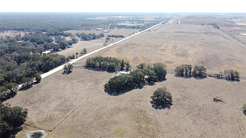 13308 Duck Lake Canal Road Dade City, FL 33525 - Photo 84 of 90 a view of a dry yard with wooden fence