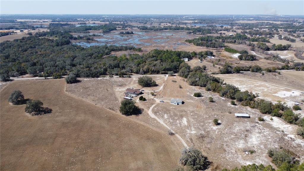 13308 Duck Lake Canal Road Dade City, FL 33525 - Photo 86 of 90 an aerial view of a house with a yard