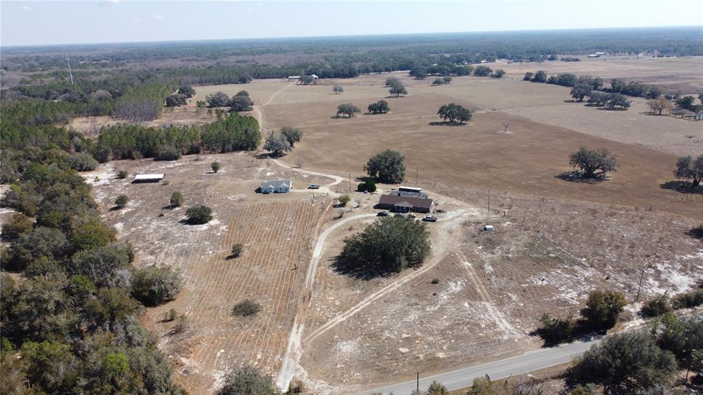 13308 Duck Lake Canal Road Dade City, FL 33525 - Photo 87 of 90 a view of a town with big yard