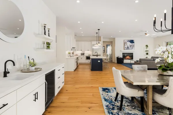 a large kitchen with cabinets a sink and appliances