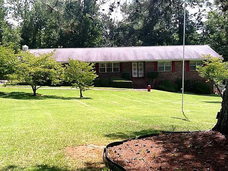 Exterior Front. Well Landscaped Lawn