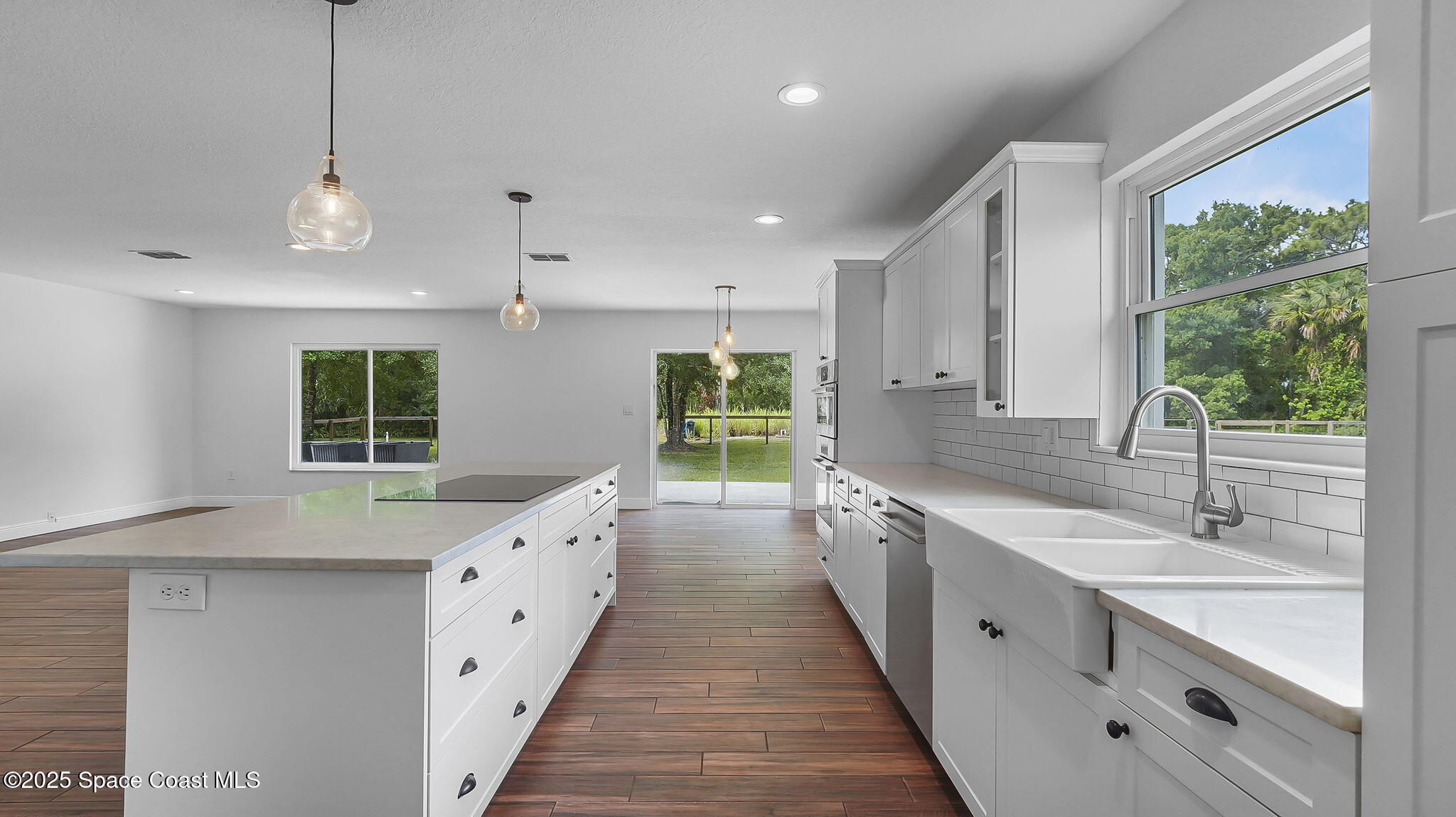 985 Hall Road Malabar, FL 32950 - Photo 12 of 39 a large white kitchen with a large window