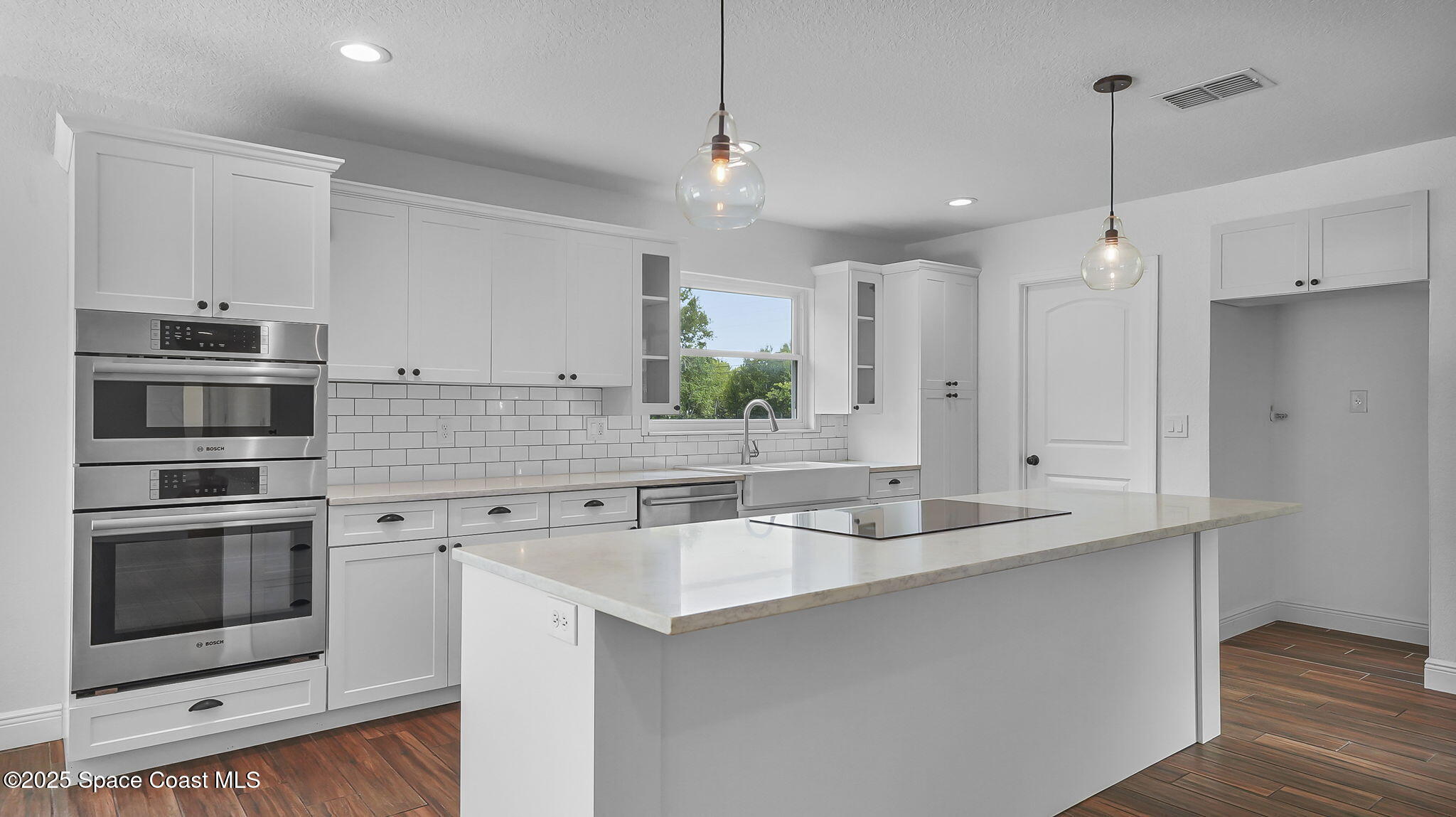 985 Hall Road Malabar, FL 32950 - Photo 13 of 39 a kitchen with a sink stove and refrigerator