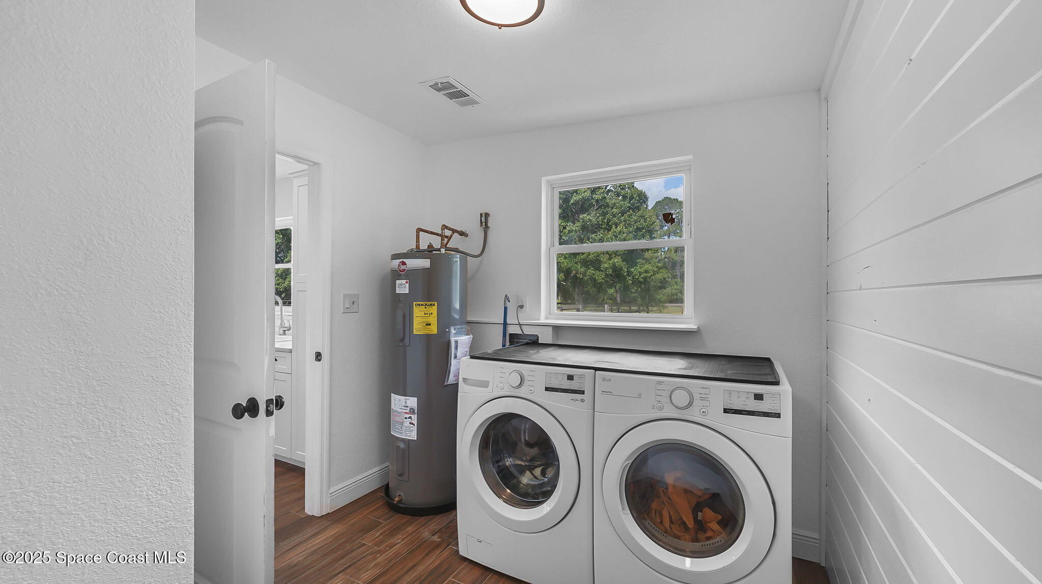 985 Hall Road Malabar, FL 32950 - Photo 16 of 39 a view of washer and dryer in a room