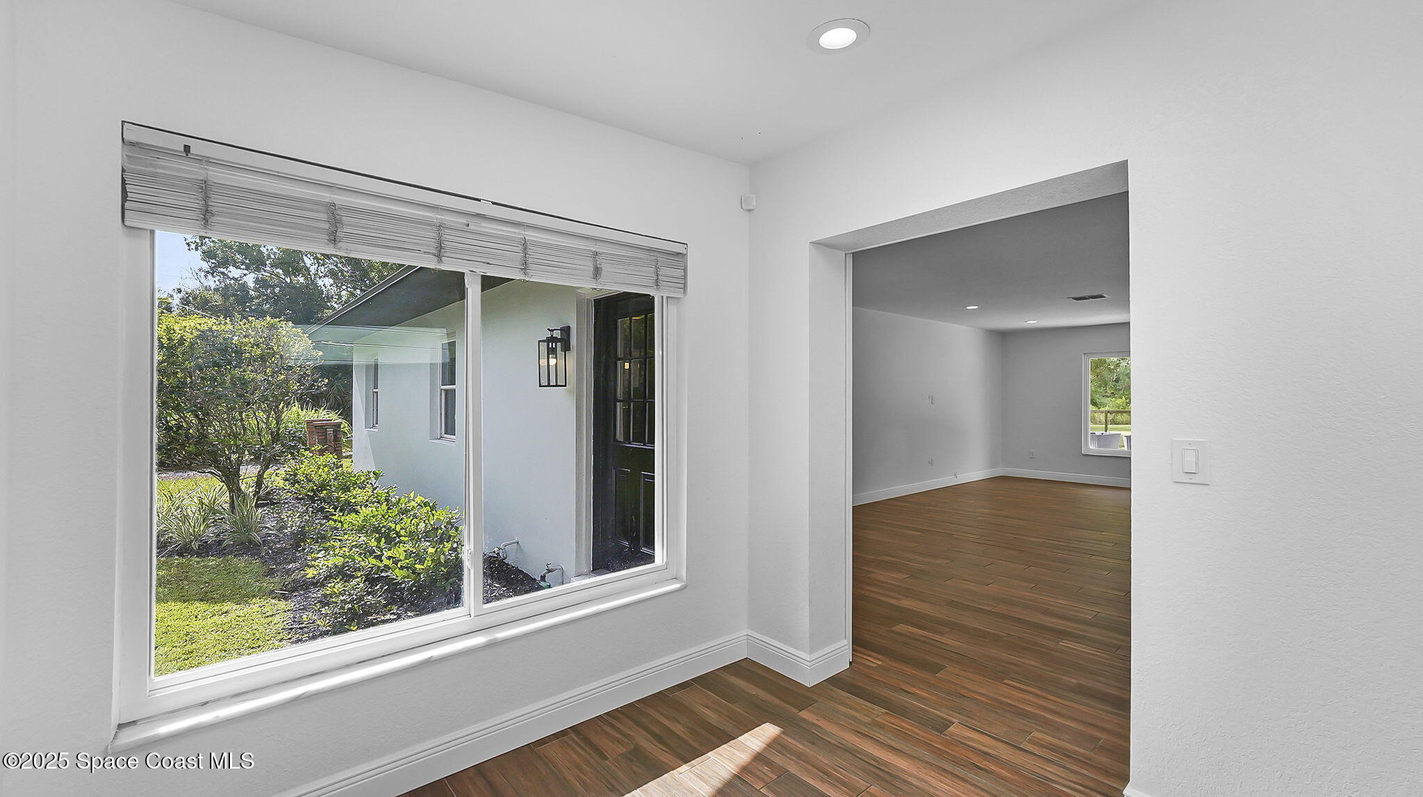 985 Hall Road Malabar, FL 32950 - Photo 18 of 39 a view of a small space with wooden floor and a window