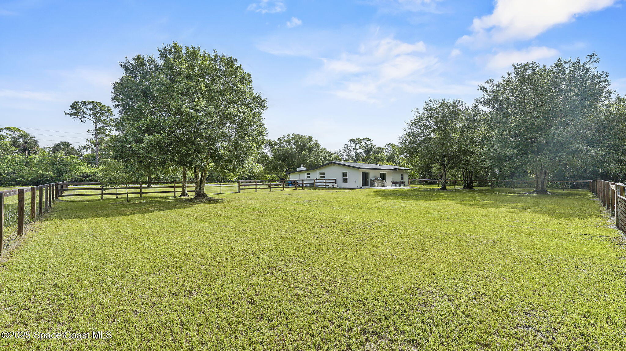 985 Hall Road Malabar, FL 32950 - Photo 34 of 39 a view of a swimming pool with an outdoor space and seating area