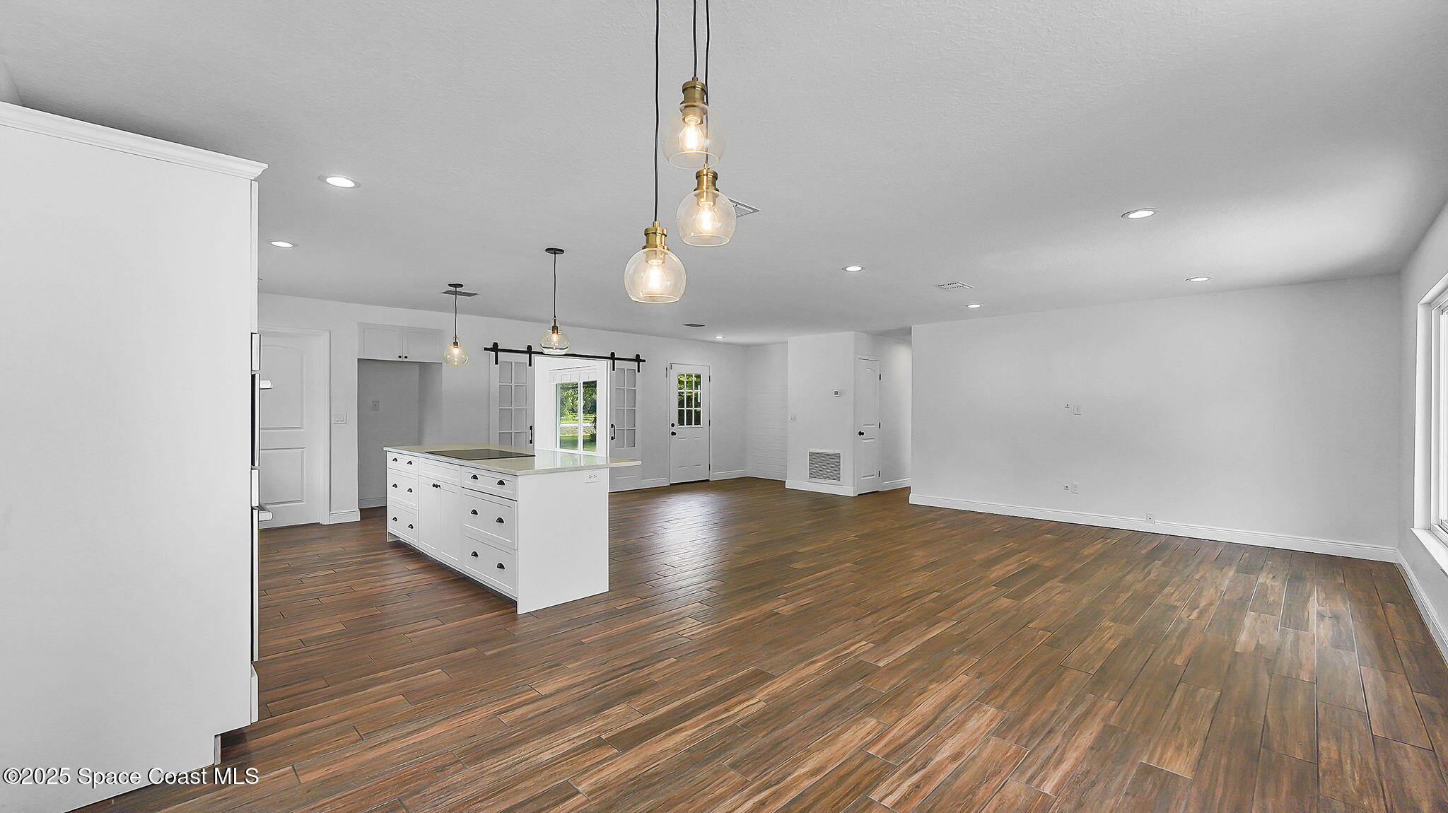 985 Hall Road Malabar, FL 32950 - Photo 9 of 39 a view of kitchen and wooden floor
