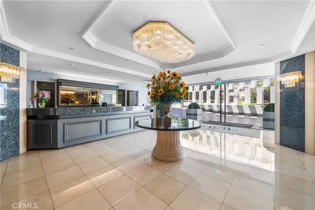 a view of a hallway with couches and entryway
