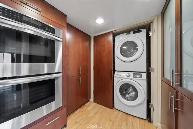 a view of a storage and utility room with washer and dryer