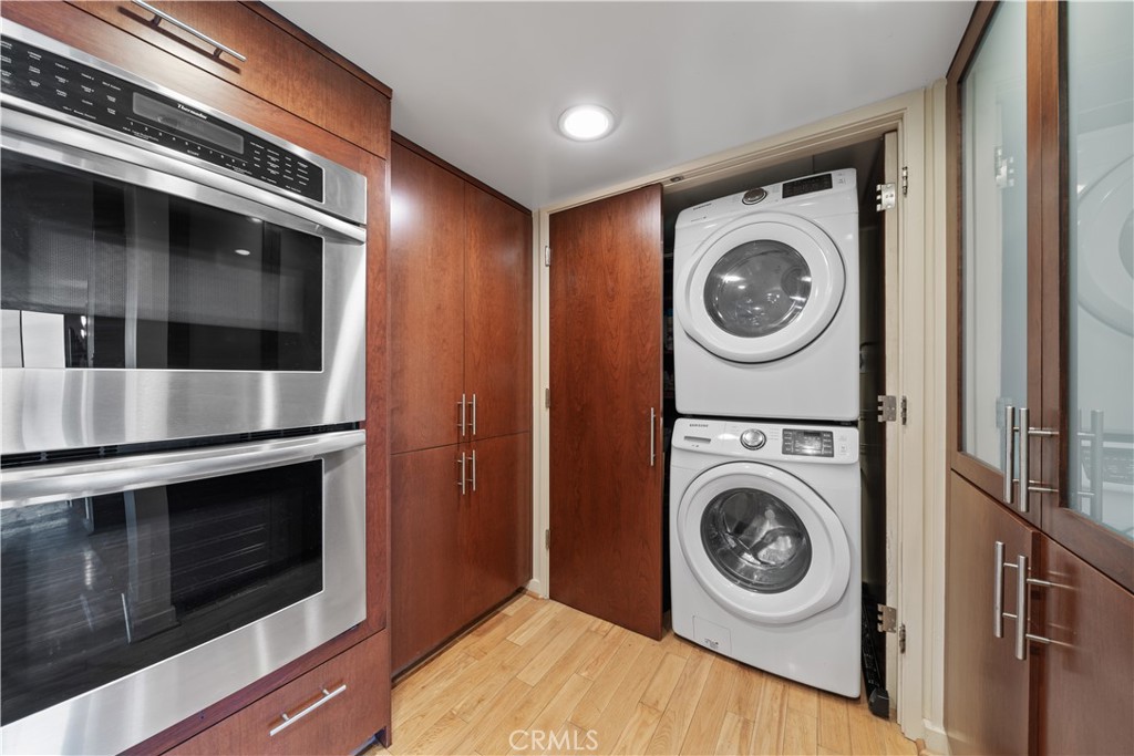 10660 Wilshire Boulevard, Unit 609 Los Angeles, CA 90024 - Photo 4 of 20 a view of a storage and utility room with washer and dryer