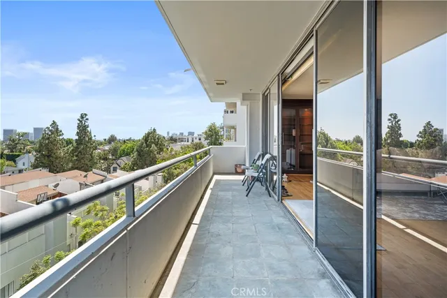 a view of a balcony with chairs