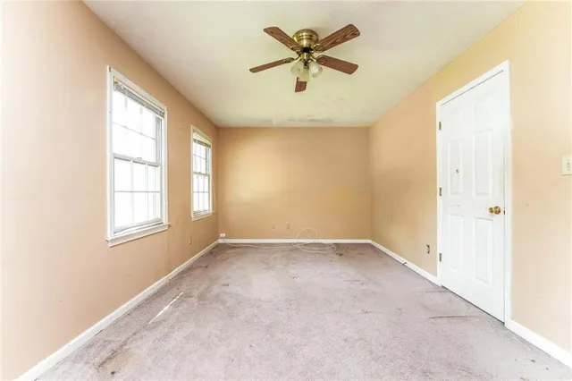 a bathroom with a sink toilet and a mirror