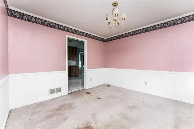 a kitchen with a sink window and cabinets