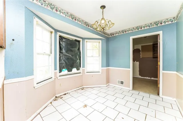 a kitchen with a cabinets and window