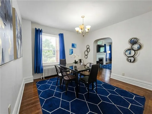 a bedroom with a bed and a fireplace