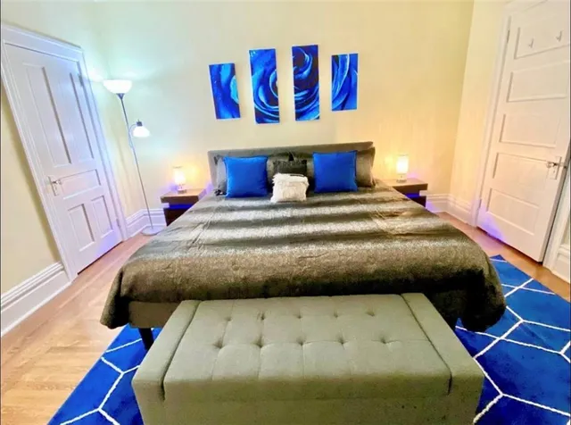 a bedroom with a bed and window