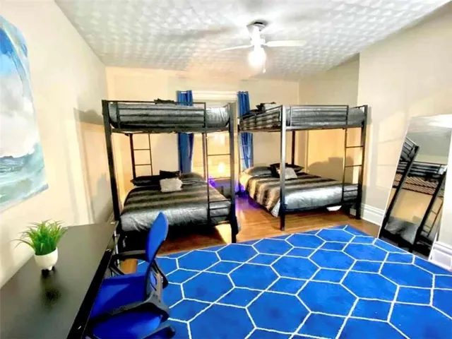 a bedroom with furniture and a window