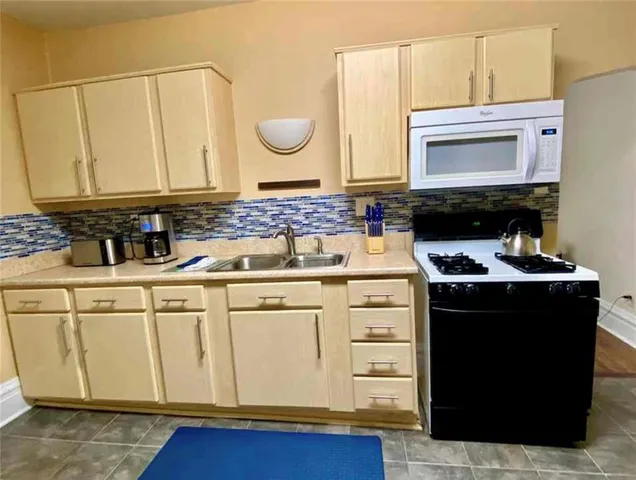 a kitchen with a stove and a microwave