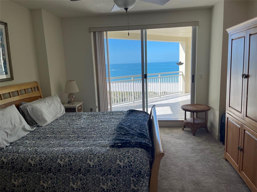 1170 Gulf Boulevard, Unit 1203 Clearwater Beach, FL 33767 - Photo 21 of 34 a bedroom with a bed and a window