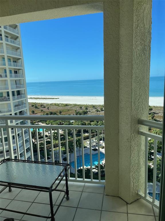 1170 Gulf Boulevard, Unit 1203 Clearwater Beach, FL 33767 - Photo 31 of 34 a view of a balcony with chair and table