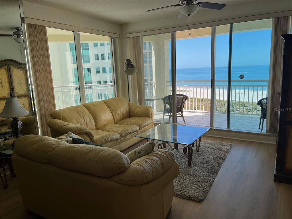 1170 Gulf Boulevard, Unit 1203 Clearwater Beach, FL 33767 - Photo 9 of 34 a living room with furniture and a large window