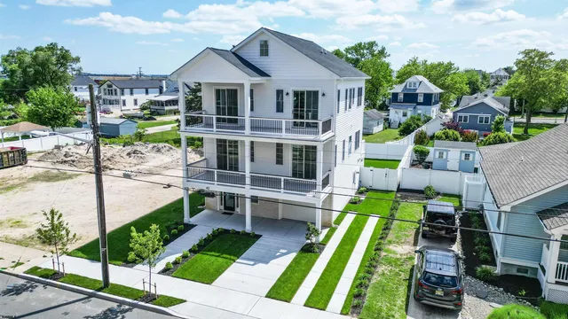 a kitchen with granite countertop a stove refrigerator and microwave