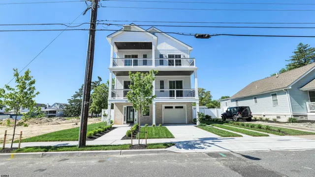 a view of a kitchen with a sink dishwasher and a fireplace