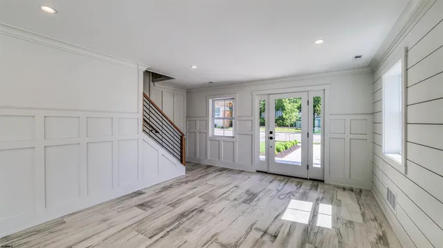a view of a bathroom with wooden floor
