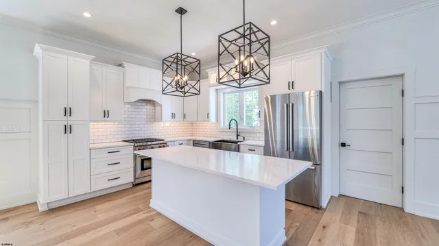 a utility room with sink dryer and washer