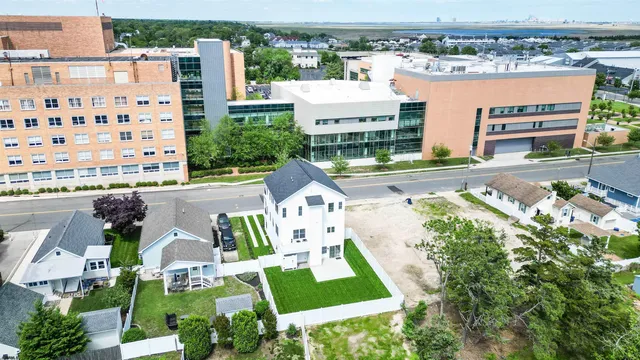 a aerial view of a house with a yard