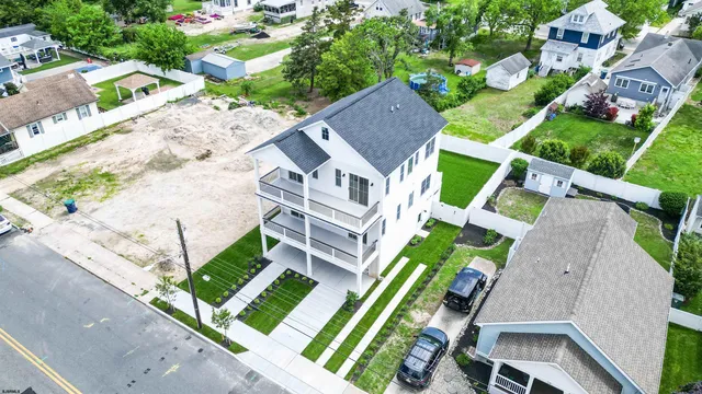 a front view of a house with a yard table and chairs