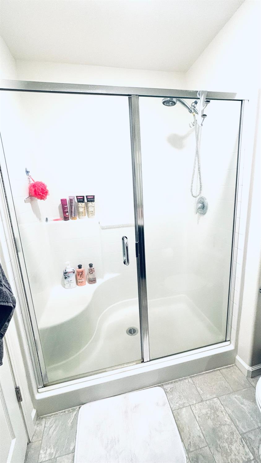 356 Solano Street Madera, CA 93638 - Photo 12 of 15 a bathroom with a shower