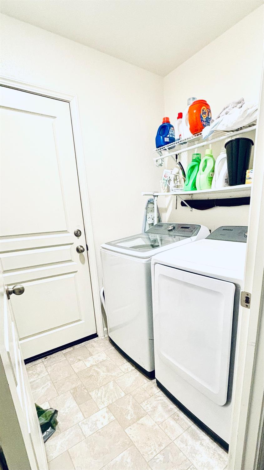 356 Solano Street Madera, CA 93638 - Photo 13 of 15 a utility room with washer and dryer