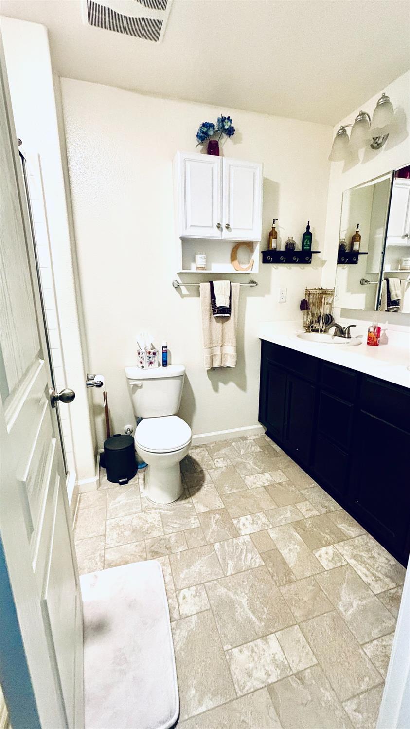 356 Solano Street Madera, CA 93638 - Photo 10 of 15 a kitchen with a sink appliances and cabinets